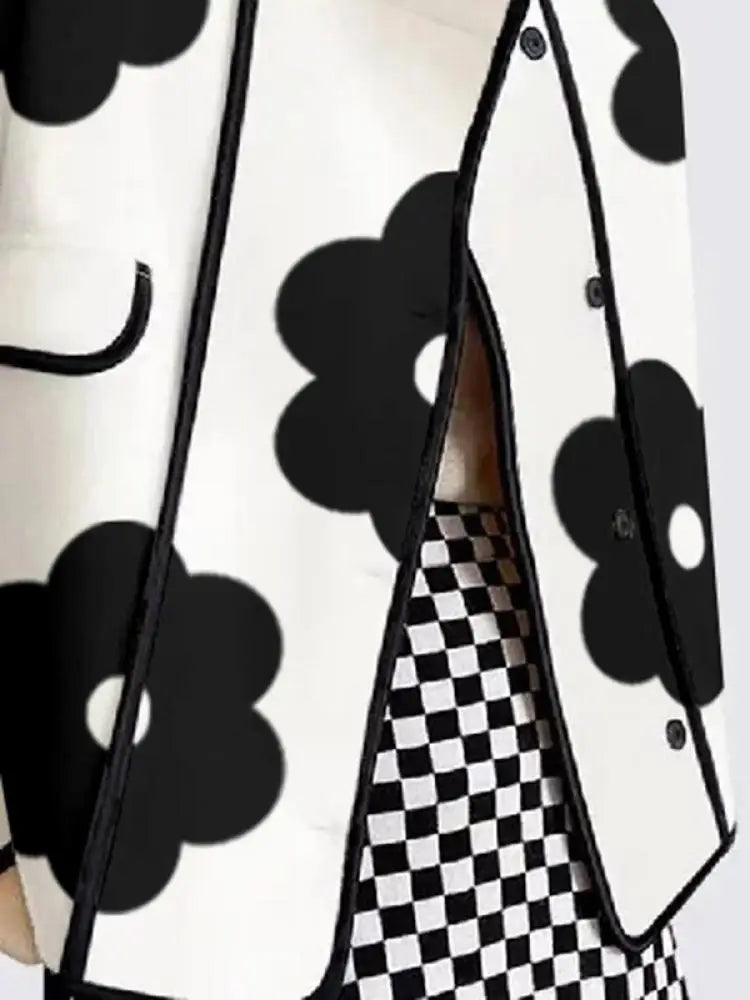 Black and white floral print top with contrasting trim and loose fit