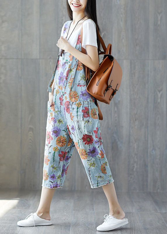 Edler hellblauer Denim-Jumpsuit mit Blumenmuster und Taschen