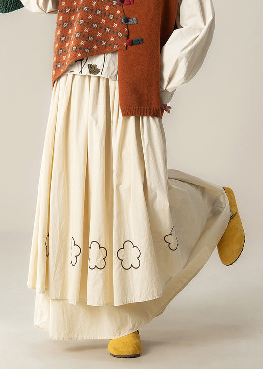 Beige bestickter Baumwollrock mit Blumenmuster und extra großem Saum für den Frühling
