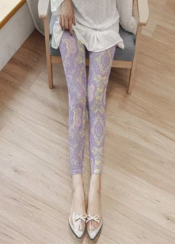Leggings mit hellviolettem Print, gerafftem Mesh-Einsatz am Po und Capri-Leggings