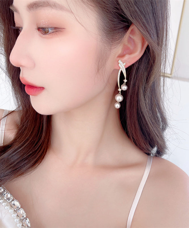 Hermosos aretes colgantes de plata esterlina dorada con perla y circonita