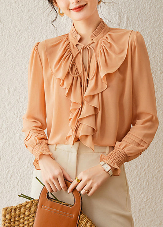 Hermosos tops de cuello alto naranja con mangas farol