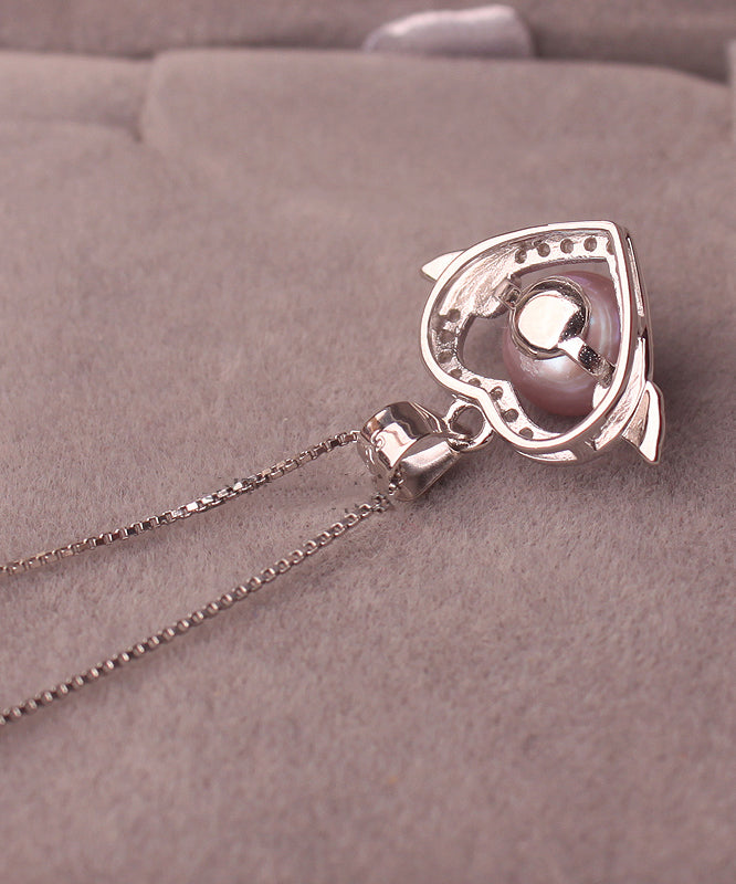 Hermoso collar con colgante de circonita y perla dorada en plata de ley rosa