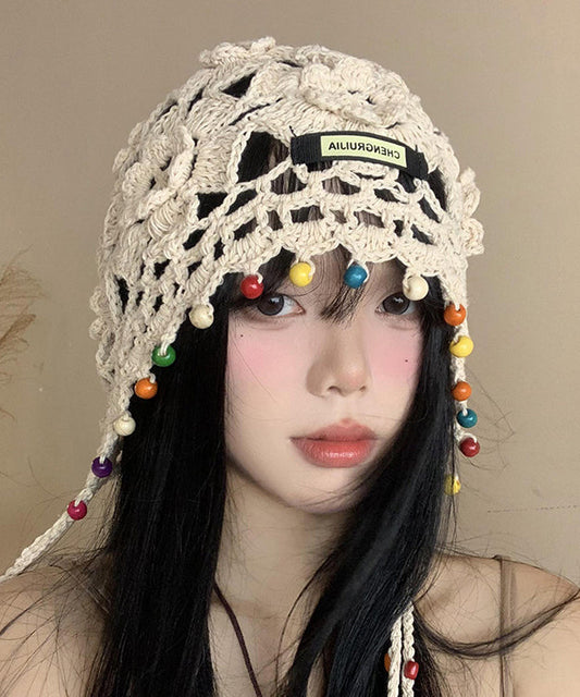 Sombrero boonie bohemio beige con borlas y flores huecas