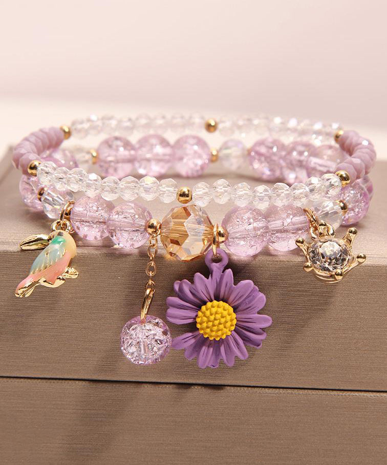 Pulsera boutique con dije de pajarito floral de cristal rosa