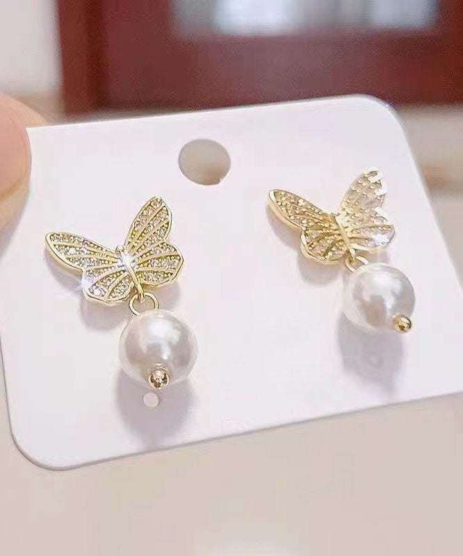 Elegantes pendientes de mariposa con perlas doradas y plateadas