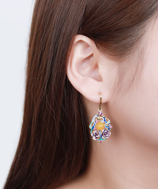 Elegantes pendientes colgantes florales de cera de abeja con incrustaciones de plata de ley en bloques de color