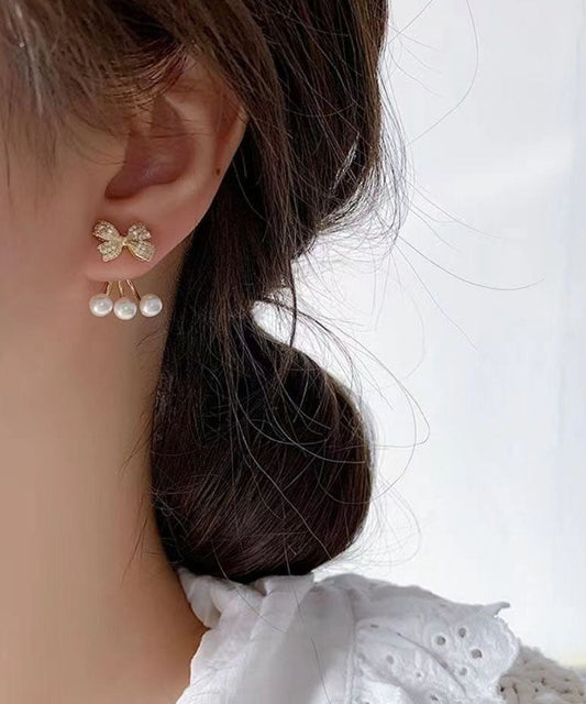 Pendientes elegantes con lazo de circonita y perla en plata de ley y oro