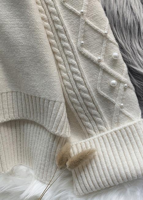 Cozy high neck beige knitwear spring fashion low high design knit tops - SooLinen