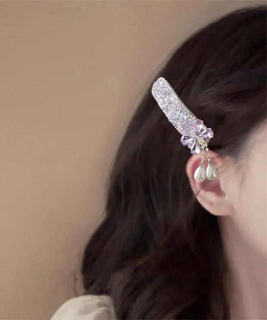 Bonita horquilla con borla de perla y circonita con lazo de aleación azul