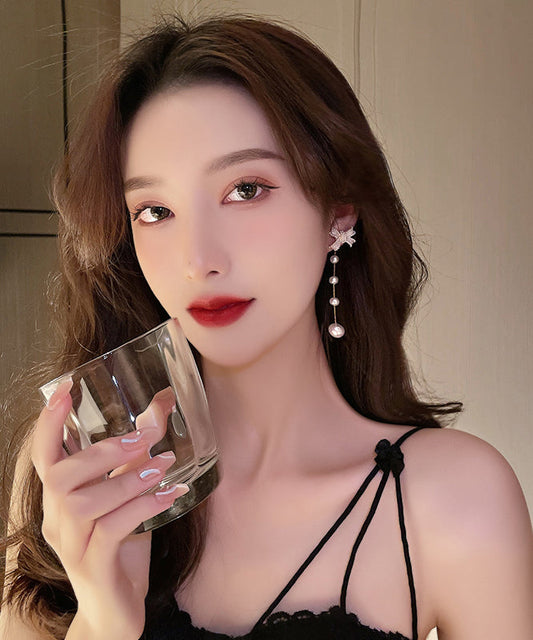 Lindos pendientes de borla con perla y lazo de aleación de plata esterlina blanca