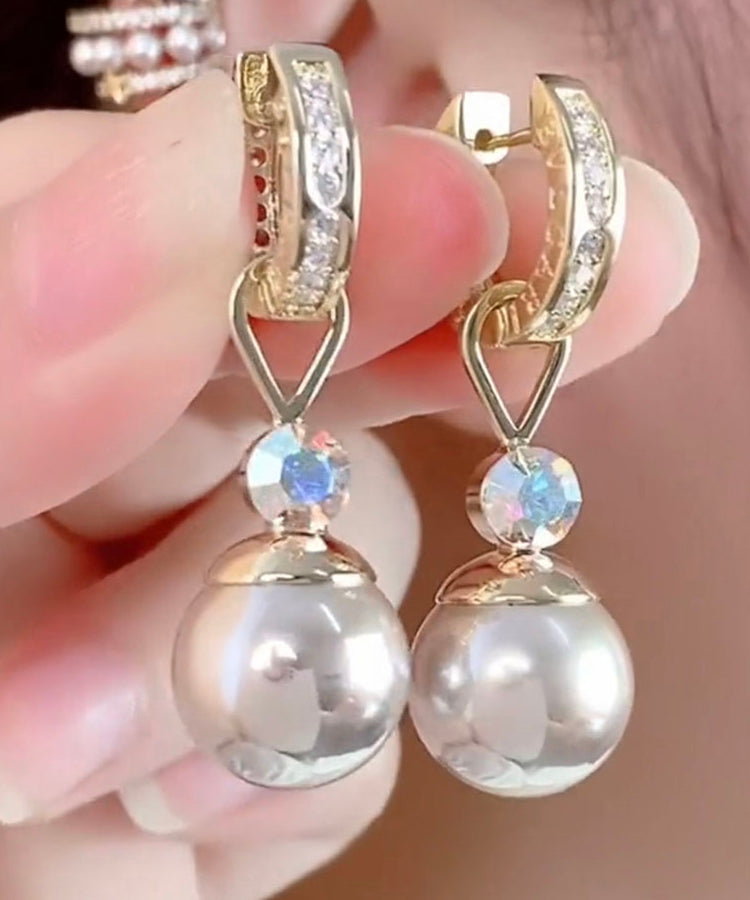 Elegantes pendientes colgantes de perlas y circonitas doradas en plata de ley Cham pagne