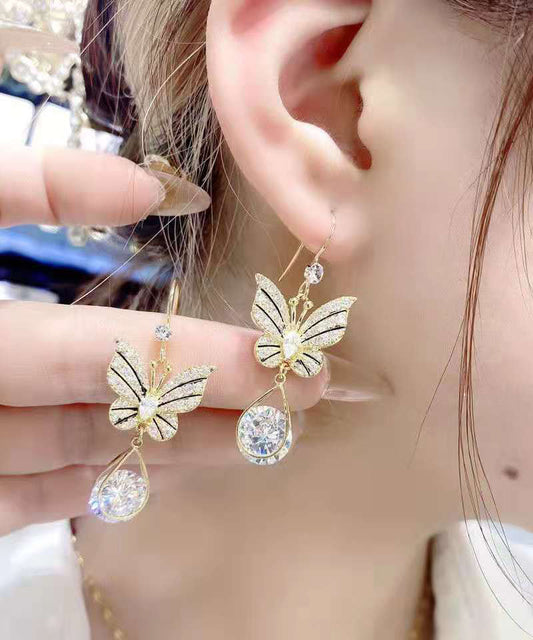 Elegantes pendientes de mariposa con cristales de circonita y aleación de oro.