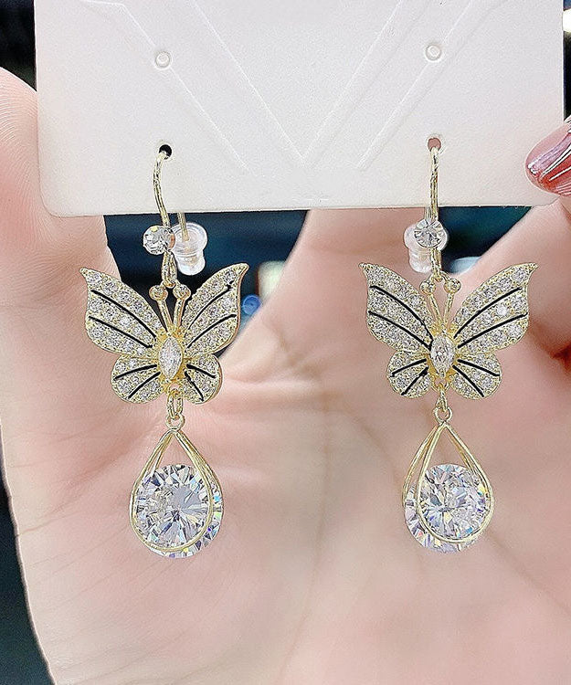 Elegantes pendientes de mariposa con cristales de circonita y aleación de oro.