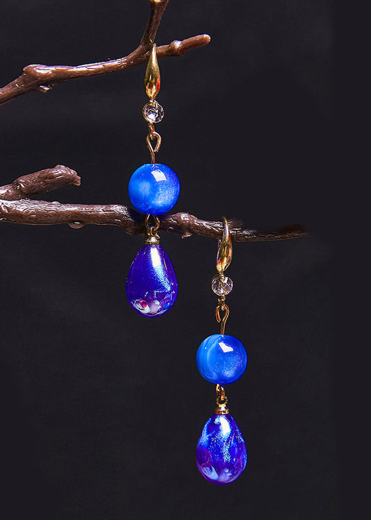 Ohrringe aus Acryl mit Pfauenblau und Wassertropfen im Ethno-Stil