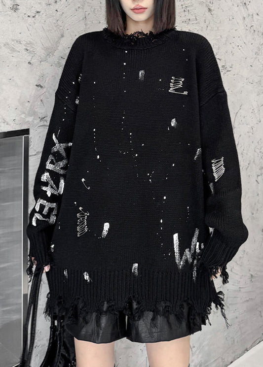 Modischer schwarzer Strickpullover aus dicker Baumwolle mit Grafikmuster und Löchern für den Herbst