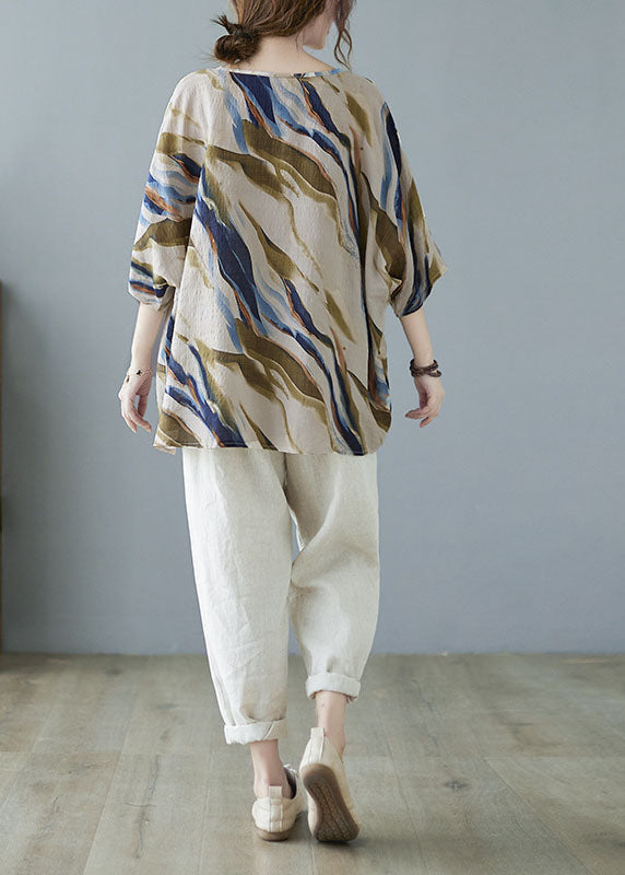 Modisches, blaues, gestreiftes Oberteil mit Fledermausflügelärmeln und V-Ausschnitt und asymmetrischem Design