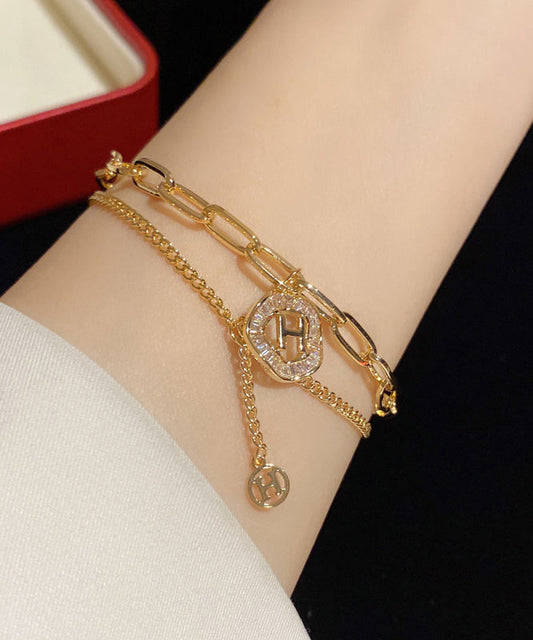 Modisches Charm-Armband mit Quaste und Kristallen in Goldlegierung
