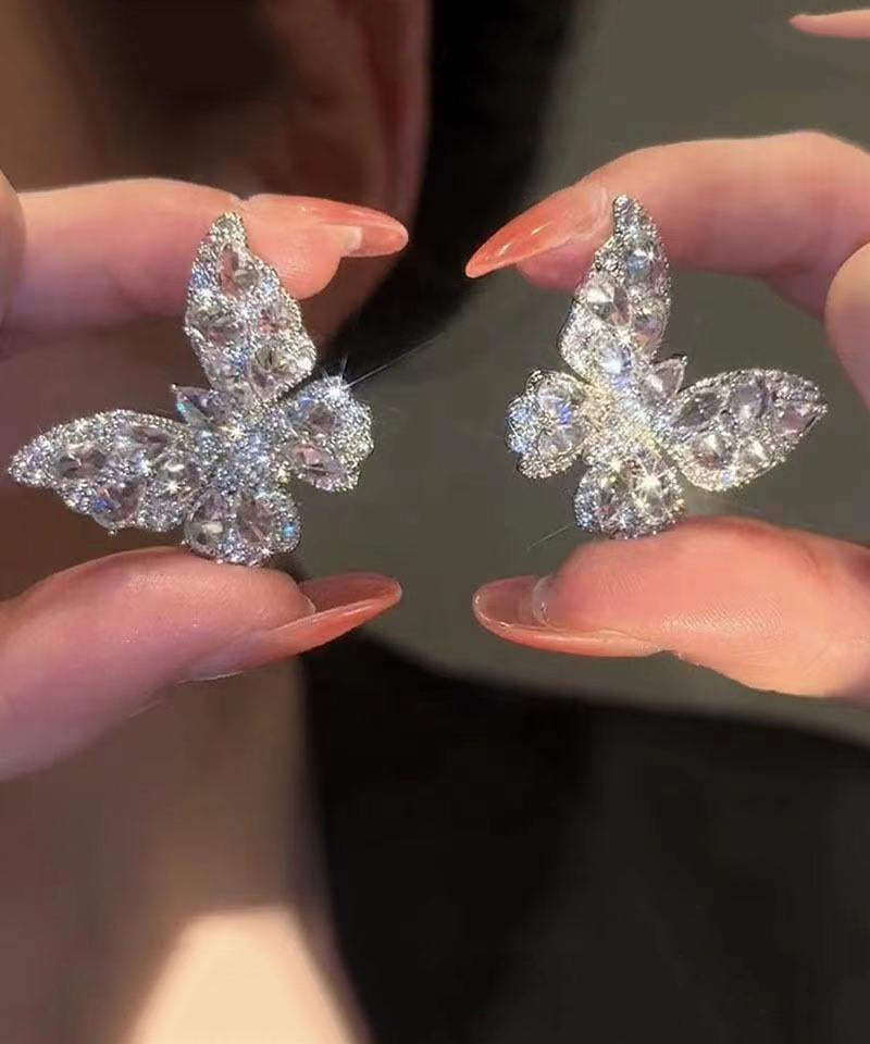 Pendientes de mariposa con circonitas y seda fina en plata de ley