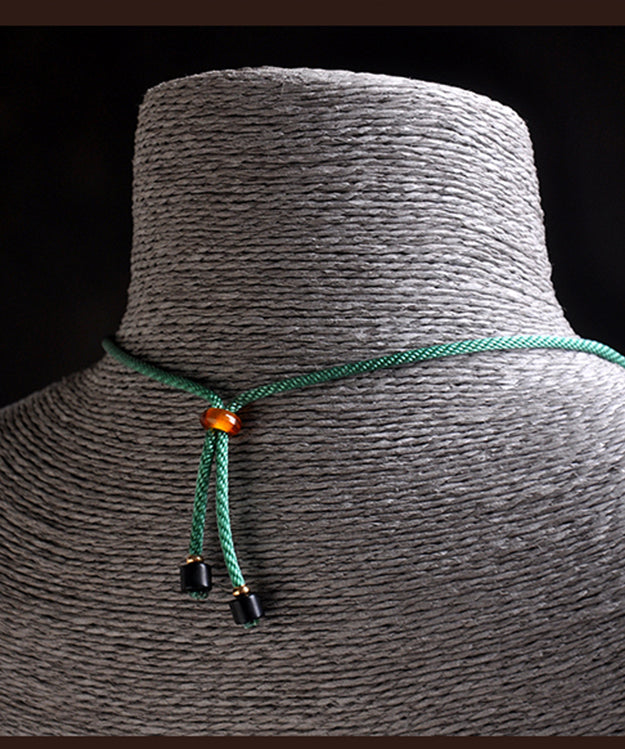 Collar con colgante de cobre verde esmaltado en color turquesa, tejido a mano