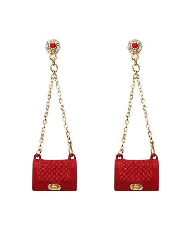 Pendientes de metal con borlas de circonitas y bolso rojo hechos a mano