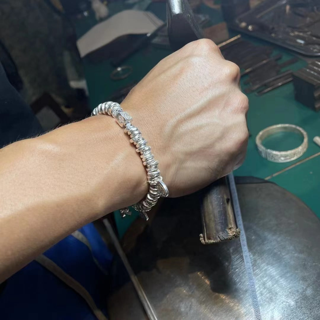 Handgefertigtes Charm-Armband aus Sterlingsilber mit gebrochener Silberquaste