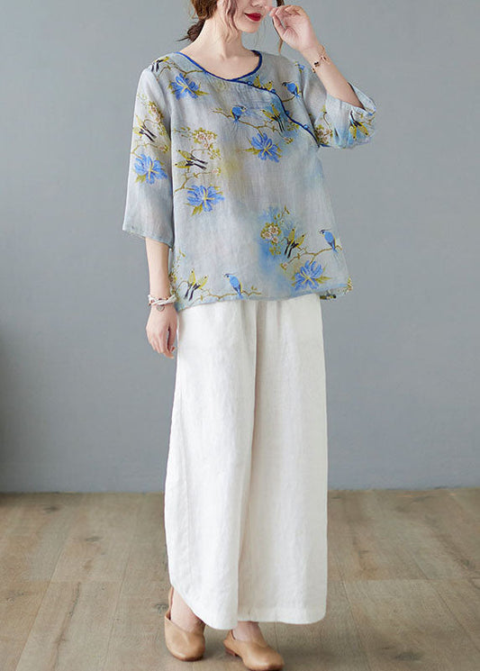 Hellblaue Blusen mit Knopfdruck und halben Ärmeln