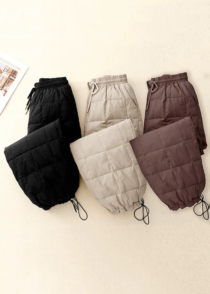 Lockere beige karierte Winterhose mit Kordelzug, elastischem Bund und feiner Baumwollfüllung