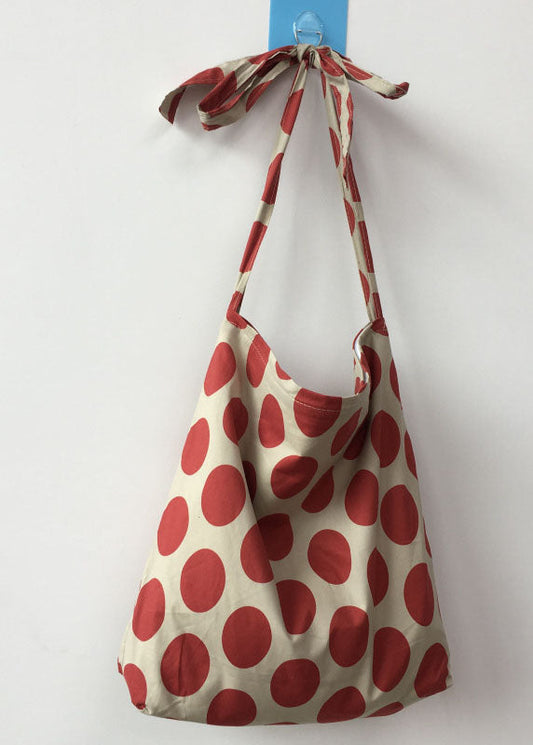 Moderne Messenger Bag aus Canvas mit orangefarbenem Punktmuster