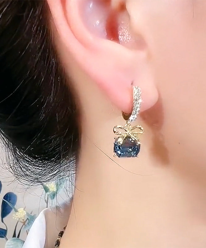 Nuevos pendientes de aro con lazo de cristal y circonitas doradas y cobre