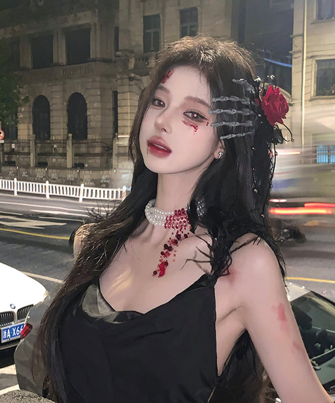 Horquilla para el pelo izquierda con forma de mano de esqueleto de rosa roja de gran tamaño