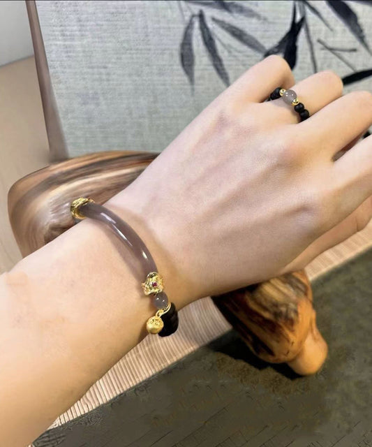 Pulsera retro con dijes de jade y patchwork de cuentas marrones