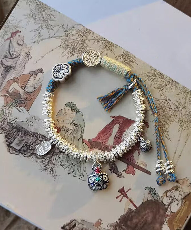 Pulsera con dije de bestia devoradora de oro, plata de ley y seda retro