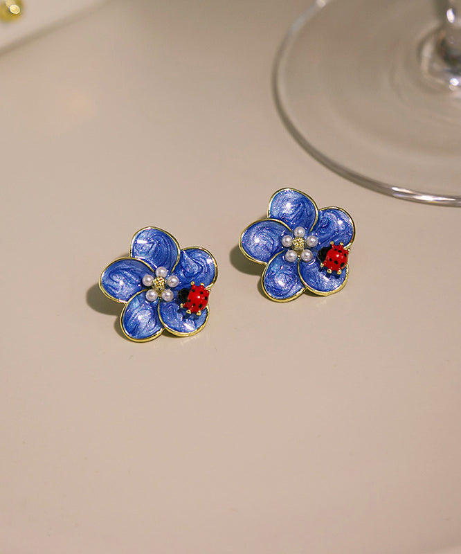 Pendientes sencillos de aleación azul con diseño de mariquita con siete estrellas y perlas de aceite