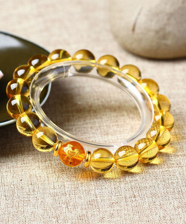 Dünnes Armband mit den zwölf chinesischen Tierkreiszeichen und gelbem Kristall