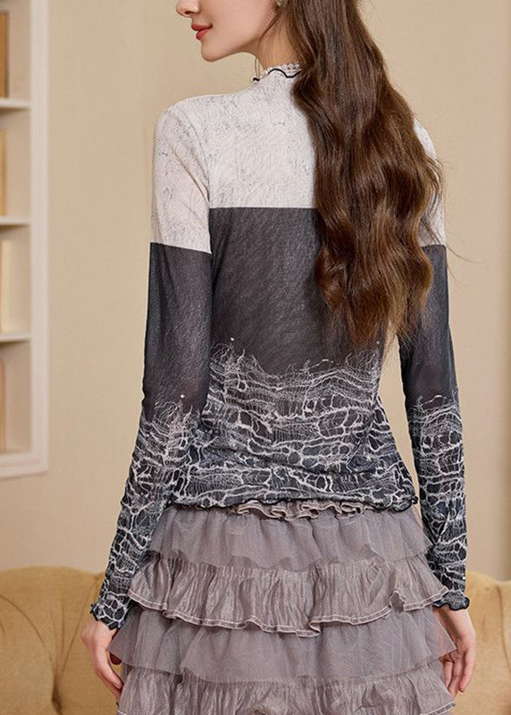 Top ajustado con cuello alto, estampado y bloques de color para primavera