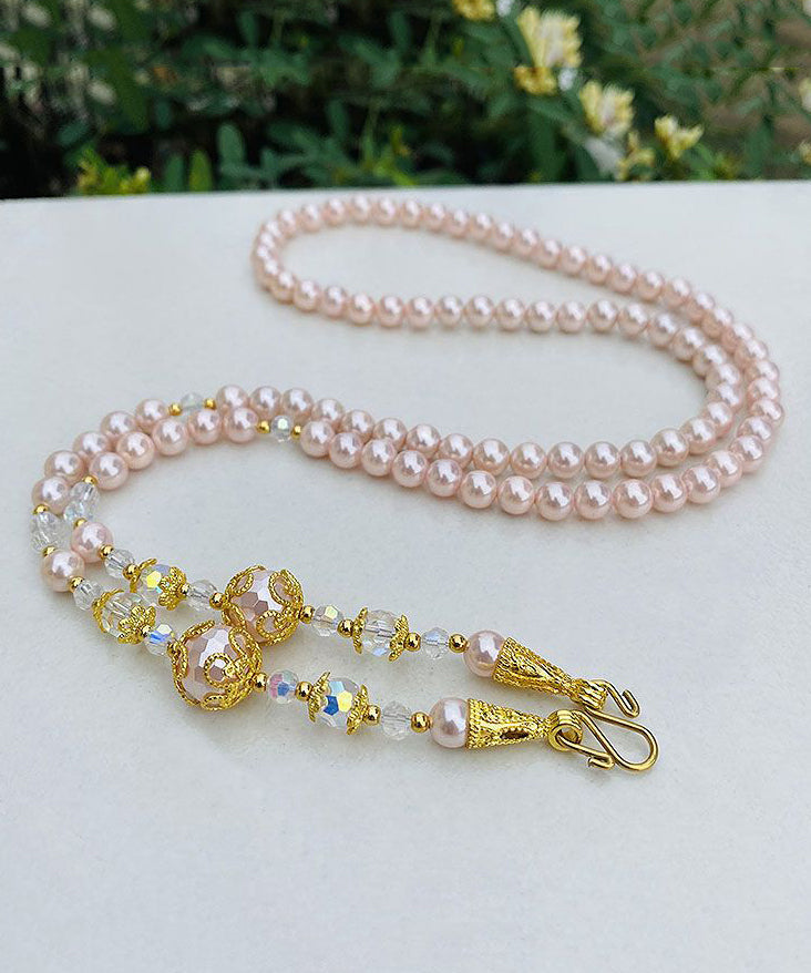 Collar de cuentas de suéter con detalles dorados y degradados