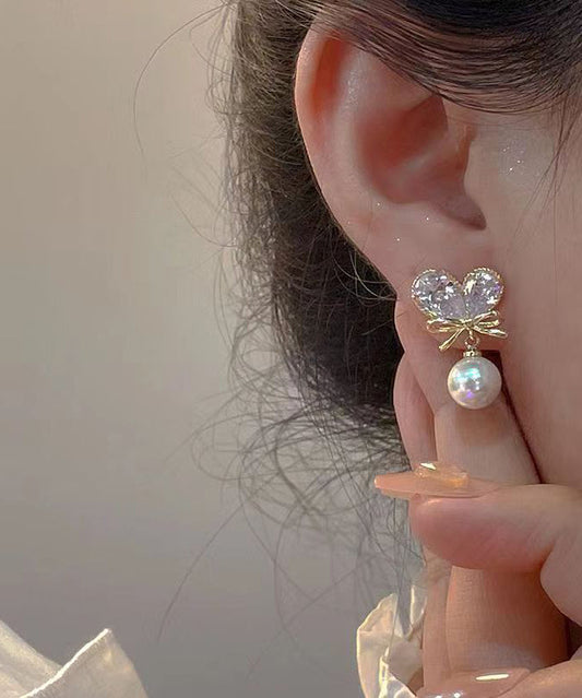 Pendientes colgantes con borlas y lazo de amor de perla y circonita de aleación de cobre blanco