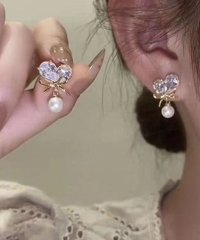 Pendientes colgantes con borlas y lazo de amor de perla y circonita de aleación de cobre blanco