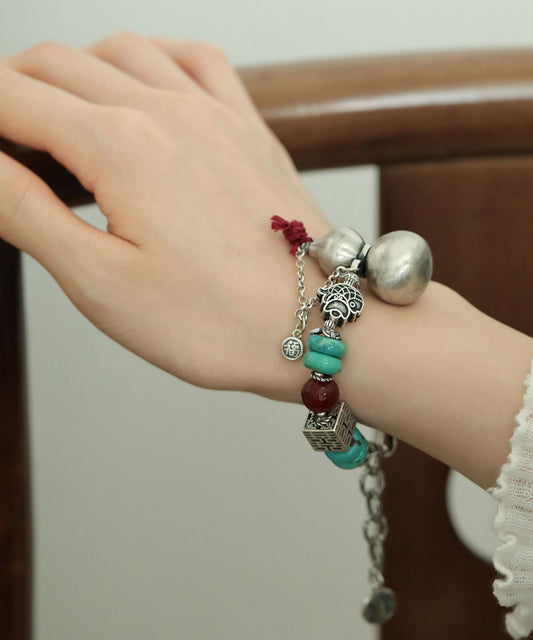 Vintage-Armband aus Seide und Sterlingsilber mit Kalebassen-Türkis-Anhänger