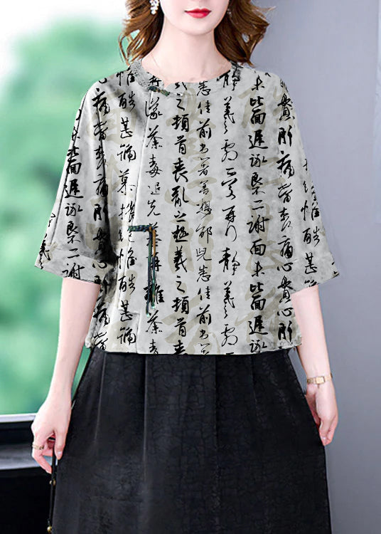 Schwarzes Patchwork-Oberteil mit O-Ausschnitt und Kranich-Print