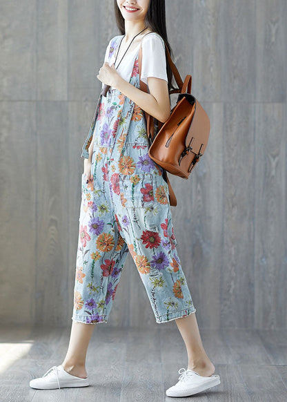 Edler hellblauer Denim-Jumpsuit mit Blumenmuster und Taschen