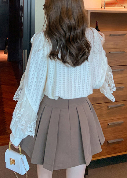 Camisa de encaje con diseño original de patchwork y botones de albaricoque con cuello alto