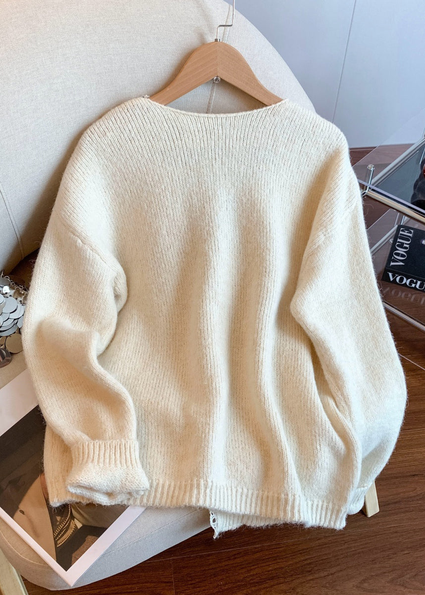 Aprikosenfarbener Wintermantel aus Strick mit Blumenmuster, Knopfleiste und V-Ausschnitt