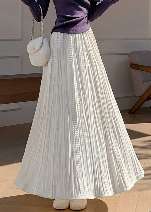 Aprikosenfarbene, hochtaillierte, einfarbige Maxiröcke aus Seidensamt mit Faltenwurf