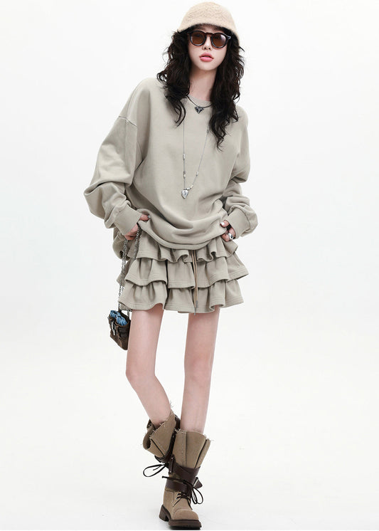 Aprikosenfarbenes, lockeres Baumwoll-Zweiteiler-Set mit Lagenrock und Rüschen für den Frühling