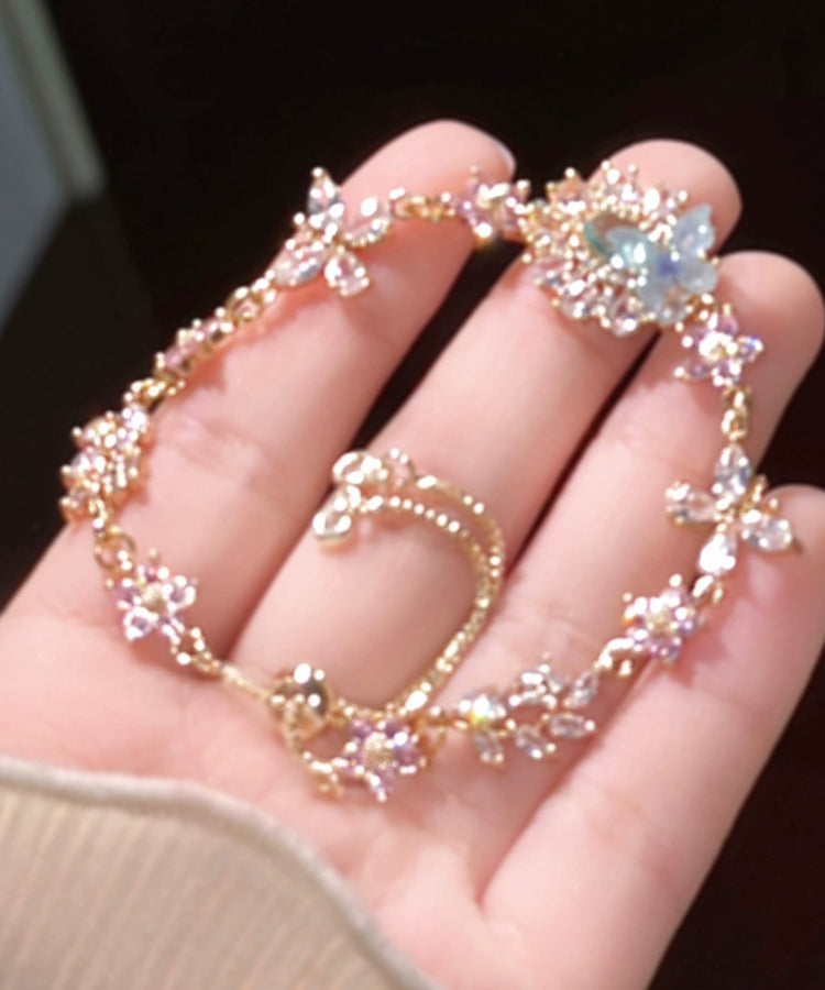 Pulsera con dije floral de mariposa y circonitas de cristal con bloques de color artísticos