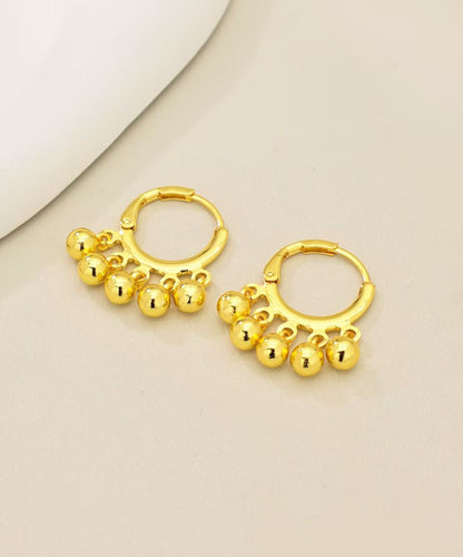 Pendientes de aro con borlas y bolas doradas de cobre