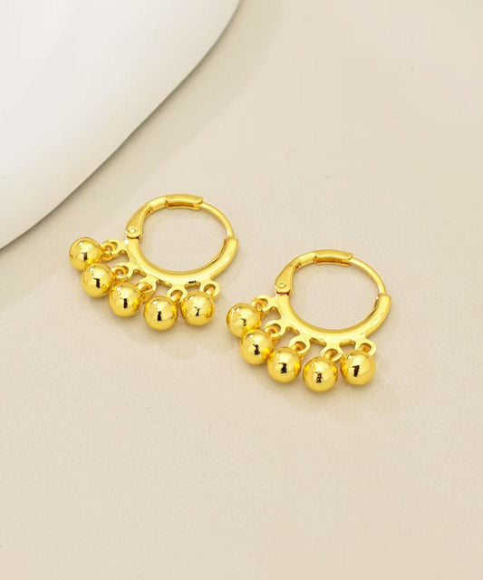 Pendientes de aro con borlas y bolas doradas de cobre
