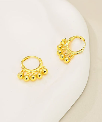 Pendientes de aro con borlas y bolas doradas de cobre